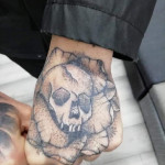 Skull hand tattoo