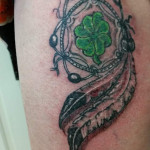 Feather pattern tattoo