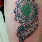 Feather pattern tattoo