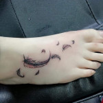 Feathers foot tattoo