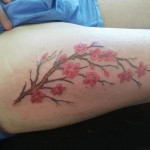 Pink flowers tattoo